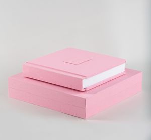 A series of minimalist pink stationery boxes shown at different angles on a light gray background.