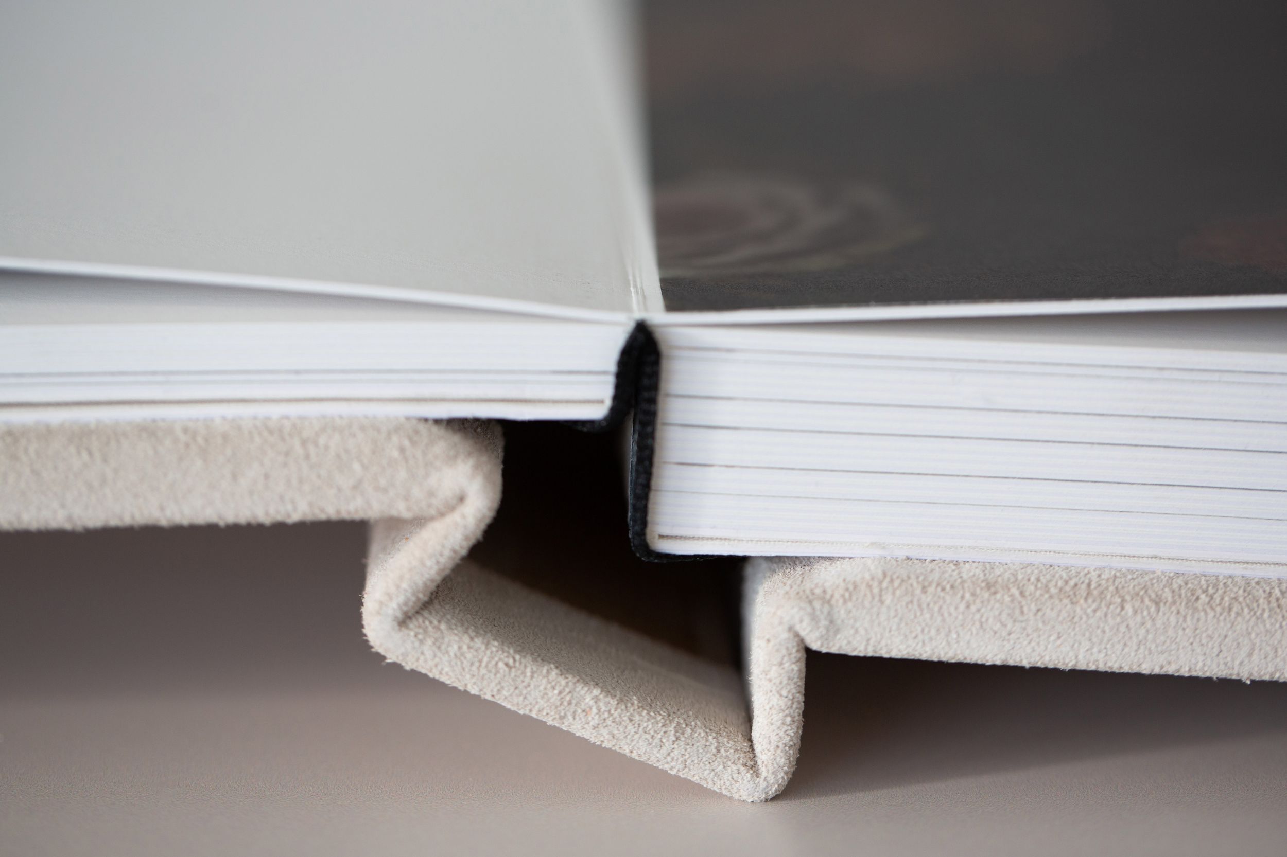Close-up detail shots of book pages and their edges showing progressive angles of open and closed positions.