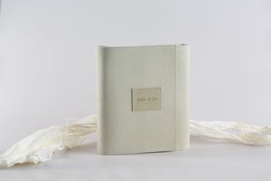 Minimalist white box packaging shown in various angles against a clean white backdrop creates an elegant product display.