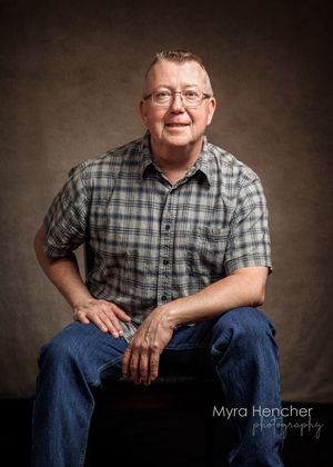 Portrait of person in blue plaid shirt and jeans sitting casually on brown backdrop in series of cropped poses.