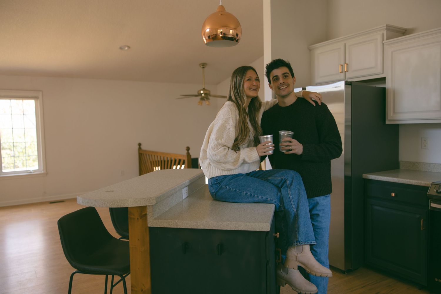 new home asheville photoshoot couples empty house lifestyle session kitchen celebrating