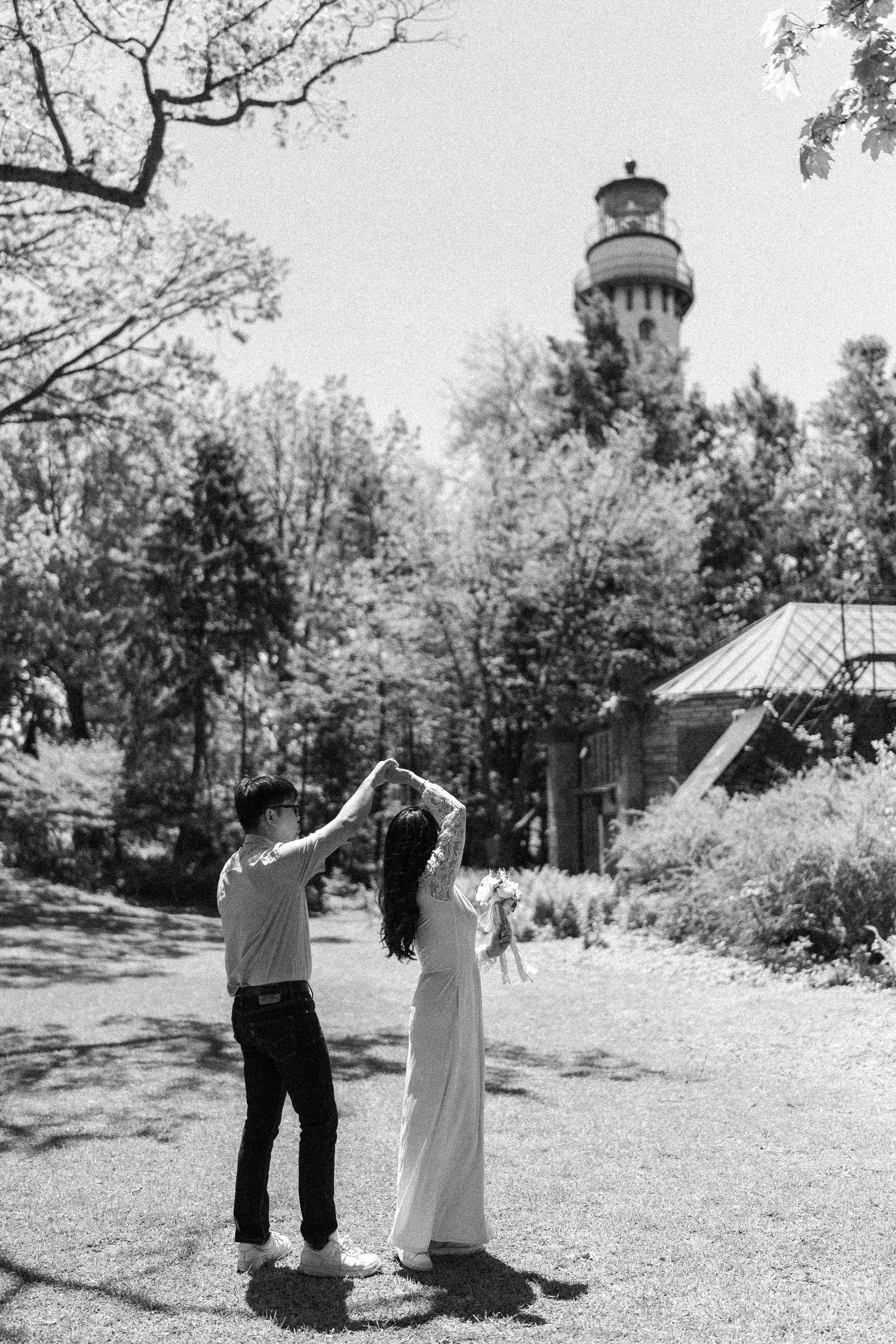 An engaged couple dancing in a beautiful garden during a minneapolis engagement photography session