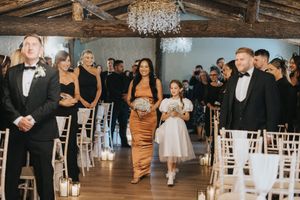 Bridesmaid and flower girl walk inbetween guests at ceremony at Grand Lodge Oaklands - taken by Grimsby photographer.