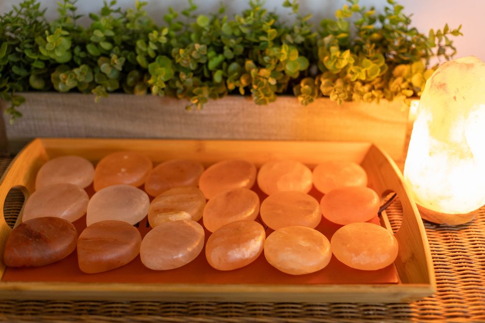 Raw salmon fillets cooking on a smoker grill rack at sunset create a mouthwatering outdoor cooking scene.