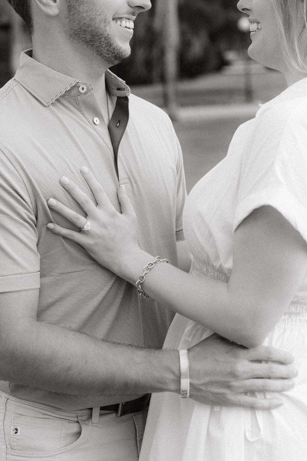 Romantic proposal at Cherokee Cottage with bride-to-be admiring engagement ring from Ascot Diamonds Atlanta.