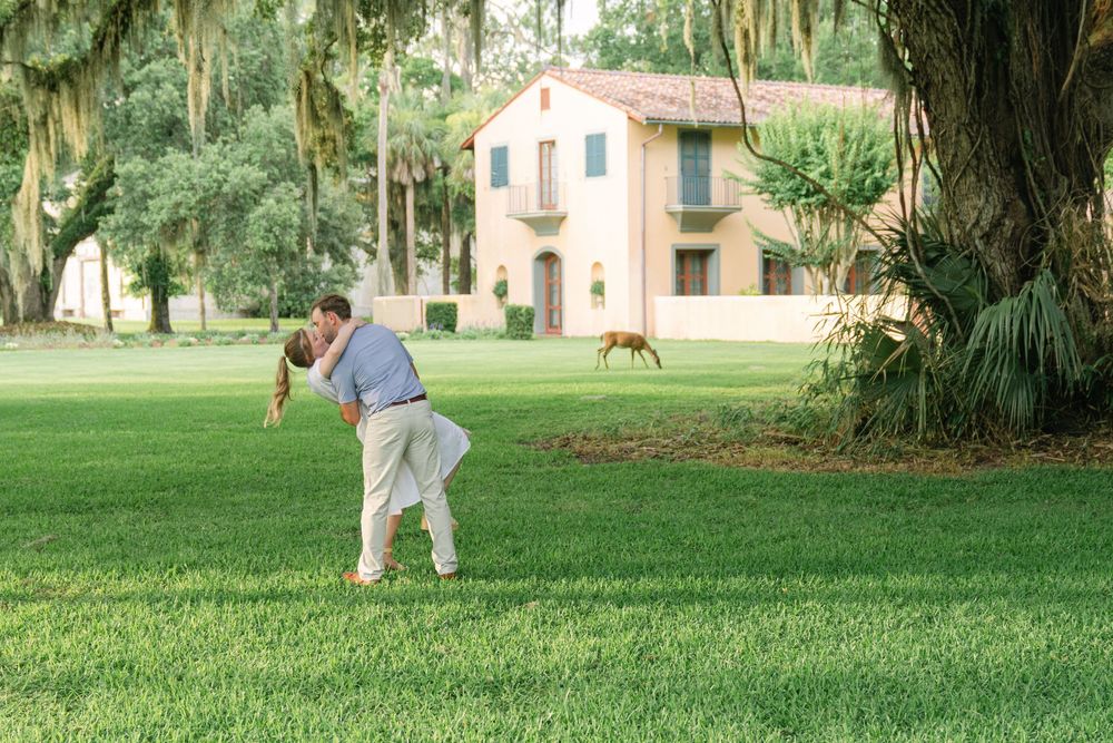 Jekyll Island proposal near Historic District Jekyll with deer in background—historic engagement photography in Georgia’s Golden Isles.