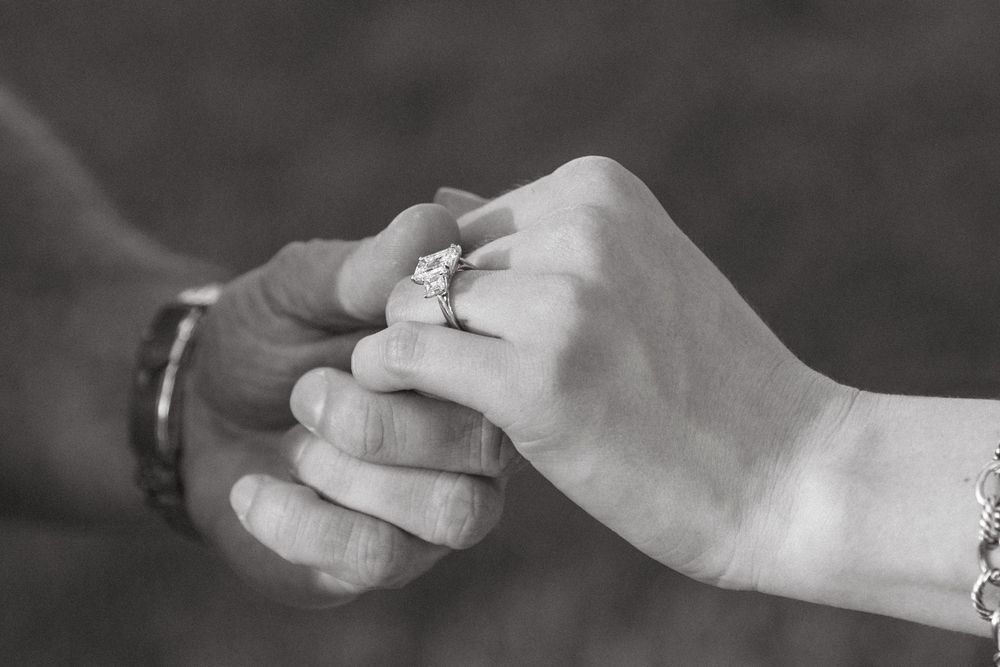Sunset proposal at Crane Cottage, Jekyll Island, with bride-to-be wearing ring from Ascot Diamonds Atlanta.
