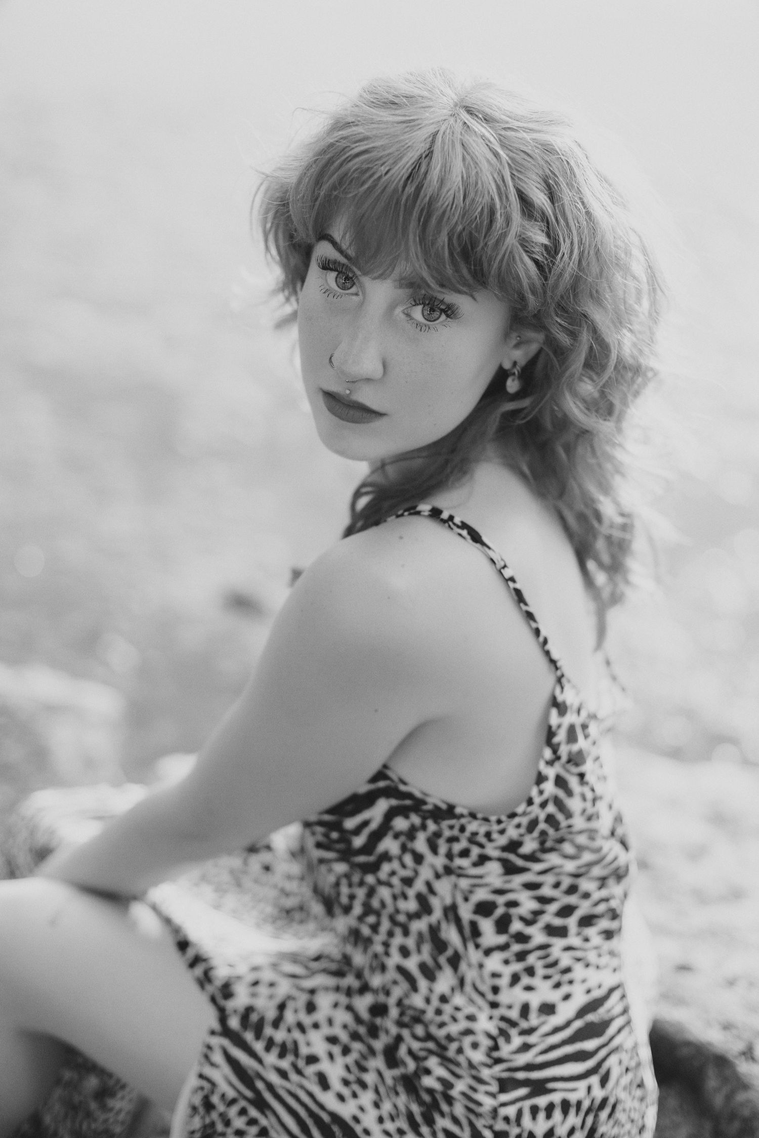 Vintage-style black and white portrait showcasing a leopard print dress.