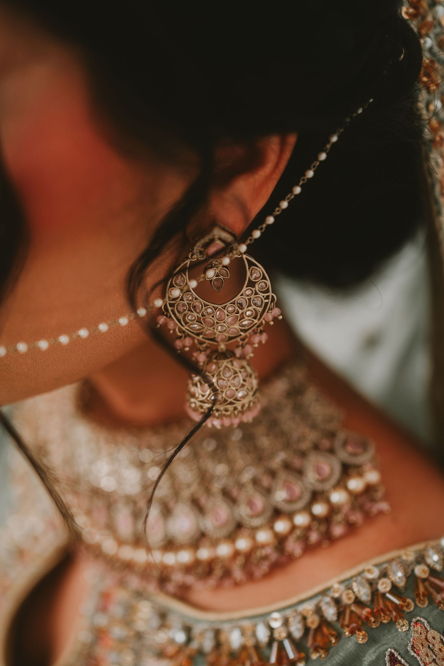 Detailed shot of ornate Indian wedding jewelry featuring intricate metalwork and traditional designs.