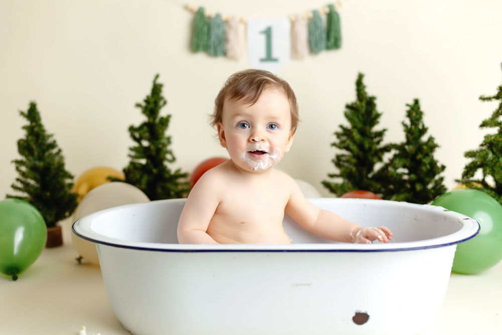 One year old in a tub for his smash-the-cake session. Greenville SC newborn photographer, Easley Sc photographer