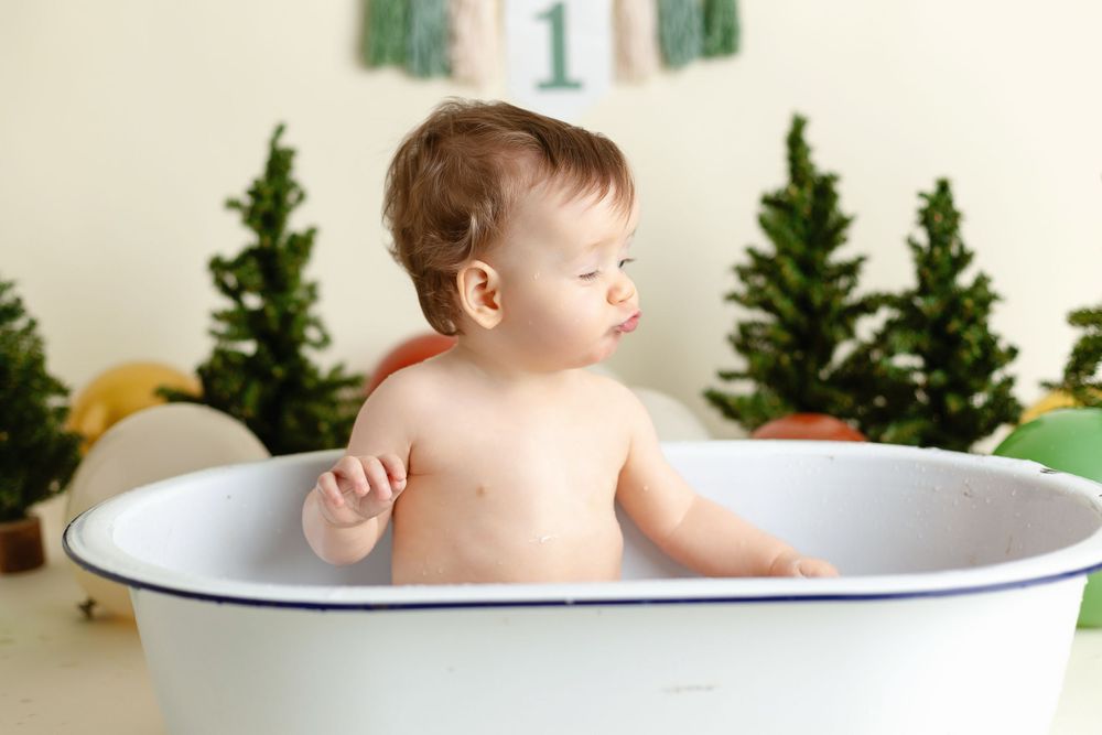 One year old in a tub for his smash-the-cake session. Greenville SC newborn photographer, Easley Sc photographer