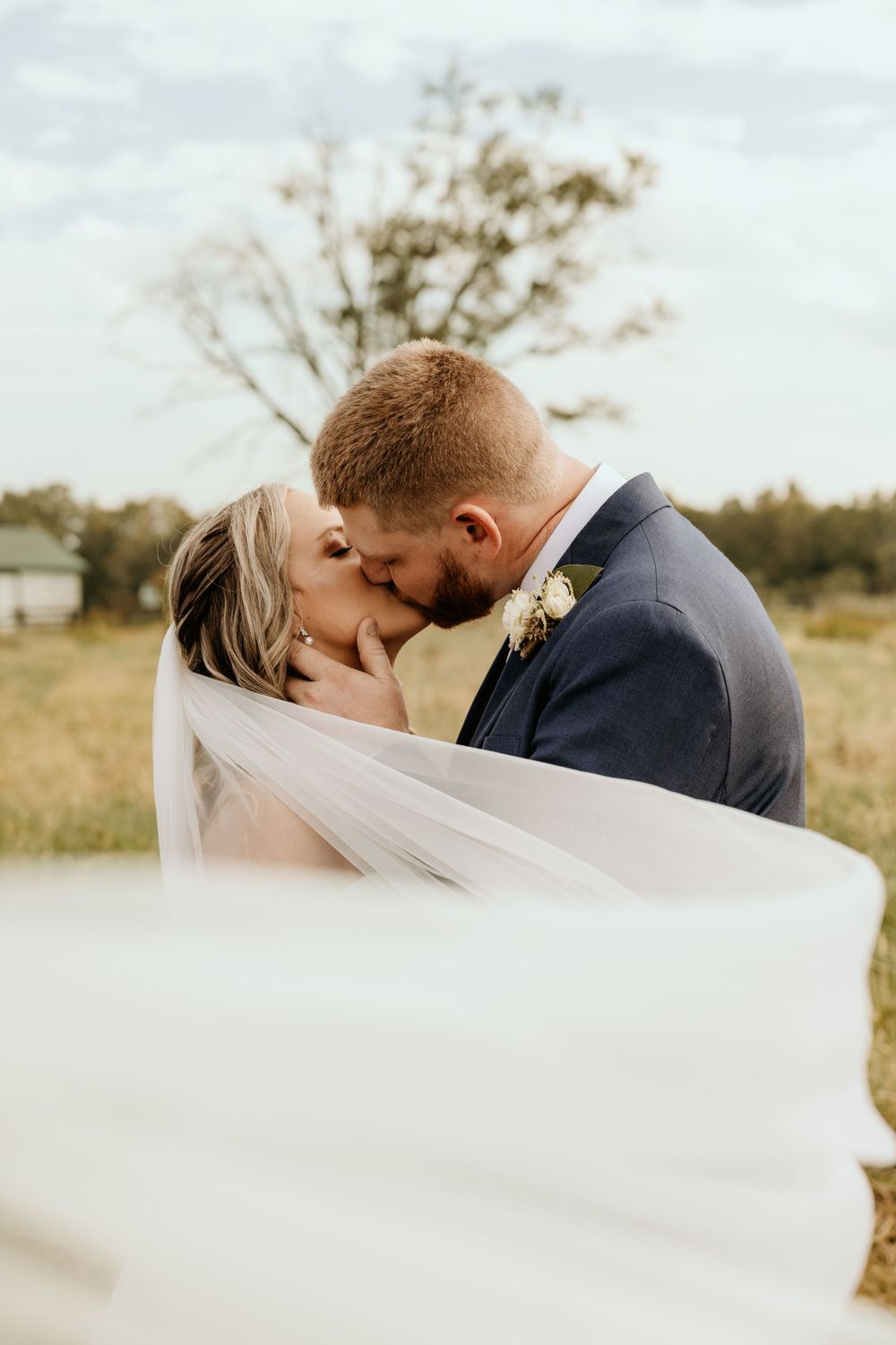 Photograph of bride and groom a Wild Daisy Farm in Molena, Georgia.