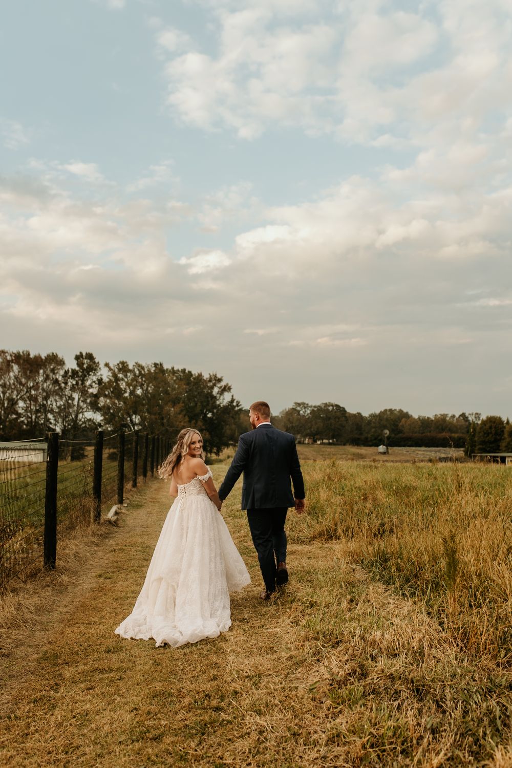 Photograph of sunset portaits with bride and groom at Wild Daisy Farm in Molena, Georgia.