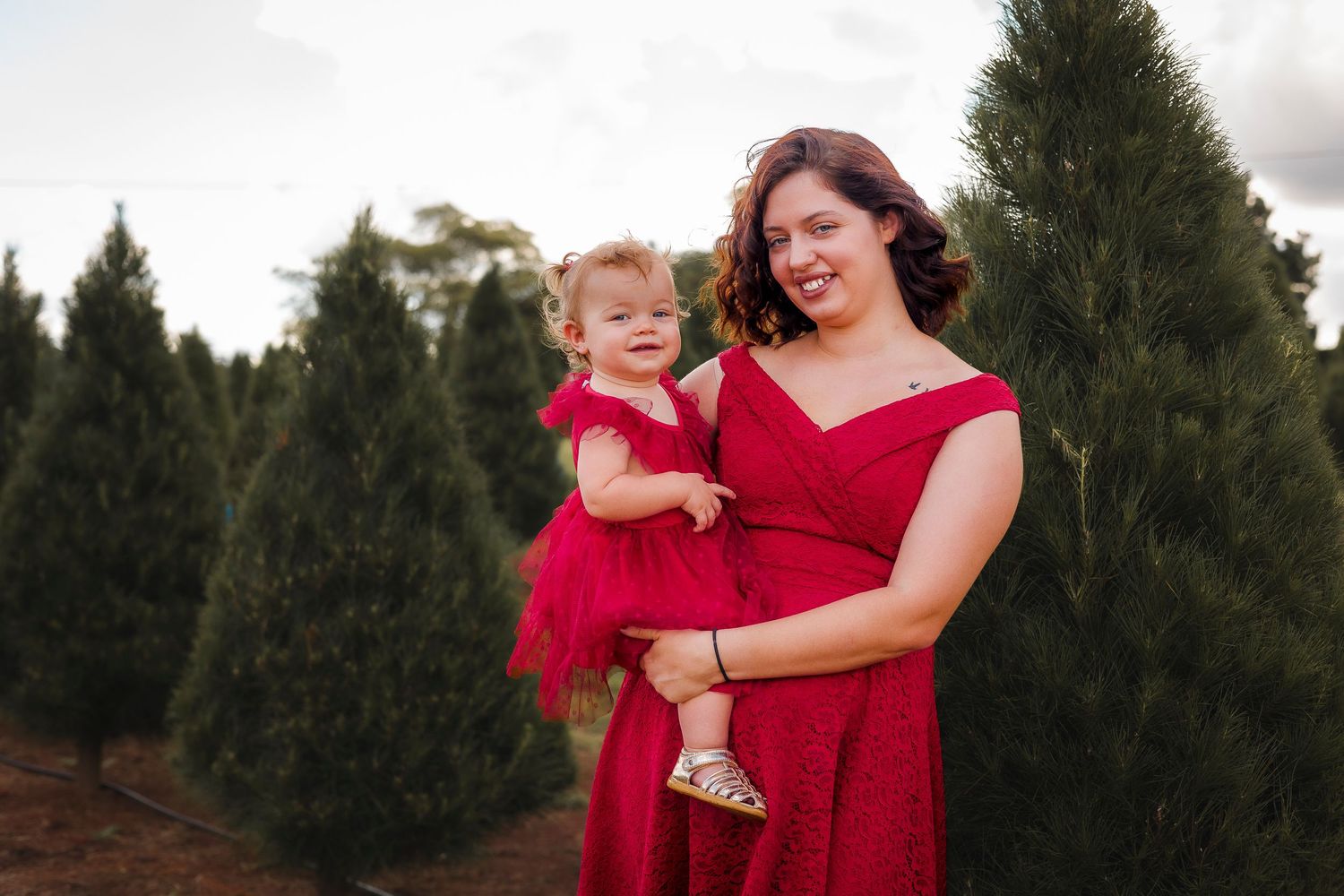 Mother and daughter celebrating Christmas with a photoshoot at the Christmas tree farm in Kingaroy, South Burnett