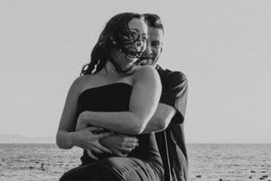 A couple by the ocean during a romantic engagement session at the Beach in White Rock, BC. Captured by an Abbotsford wedding photographer.