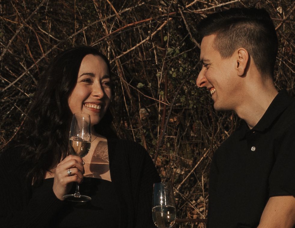 Engaged couple toasting with champagne during their Fraser Valley engagement session near Abbotsford, BC.