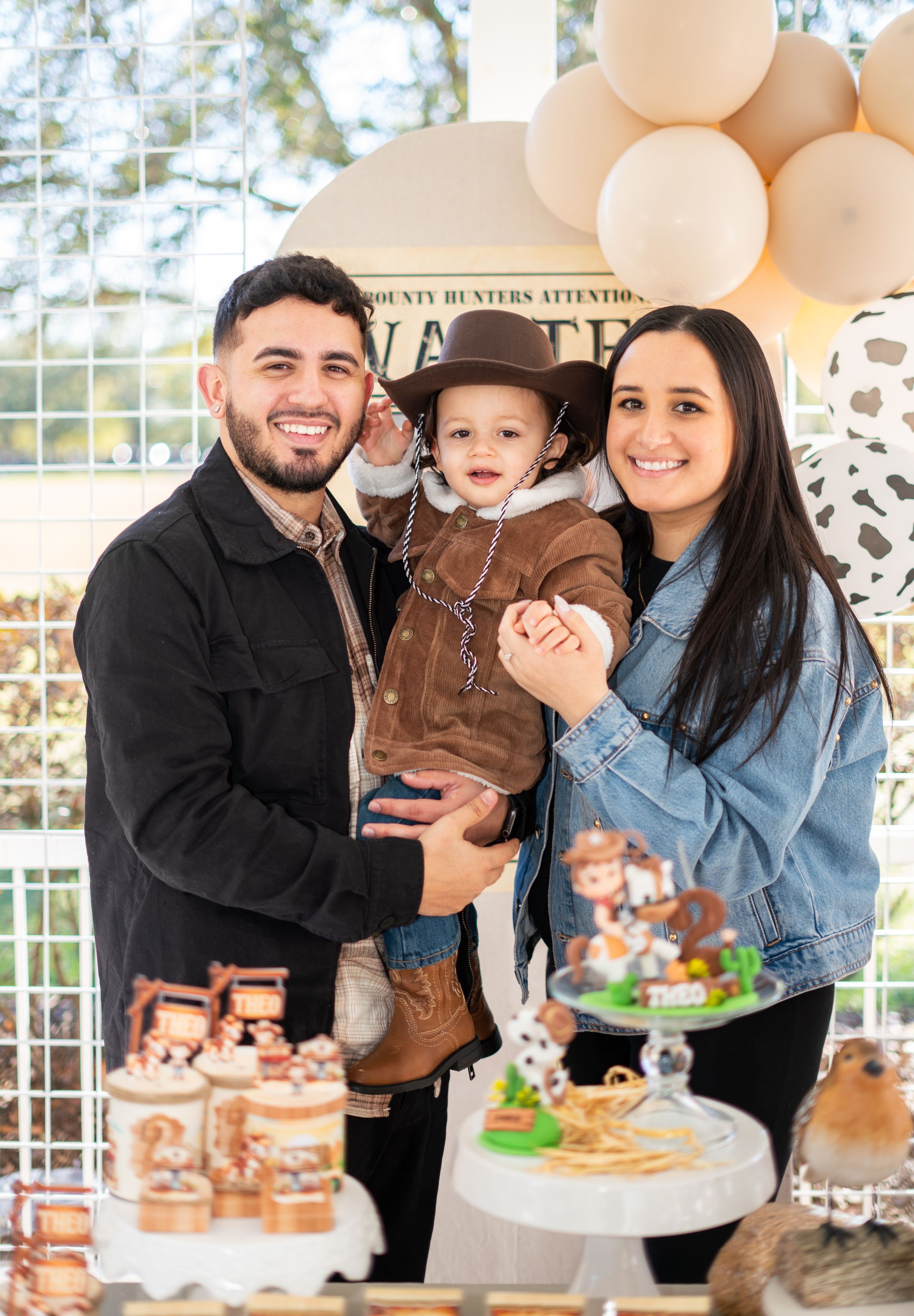 Western-themed birthday party setup with balloons and decorative elements.