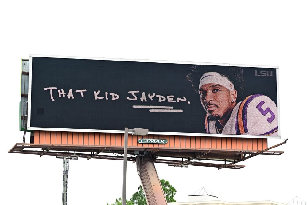Billboard featuring text 'That Kid Jayden' against dark background.