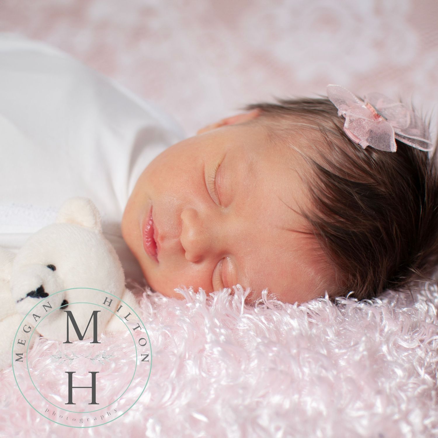 Baby girl sleeping close up photo on fuzzy pink blanket