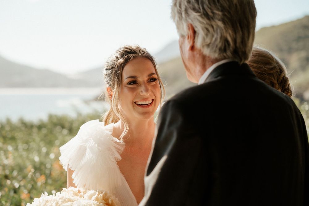 Emotional wedding moment shared during outdoor mountain ceremony.