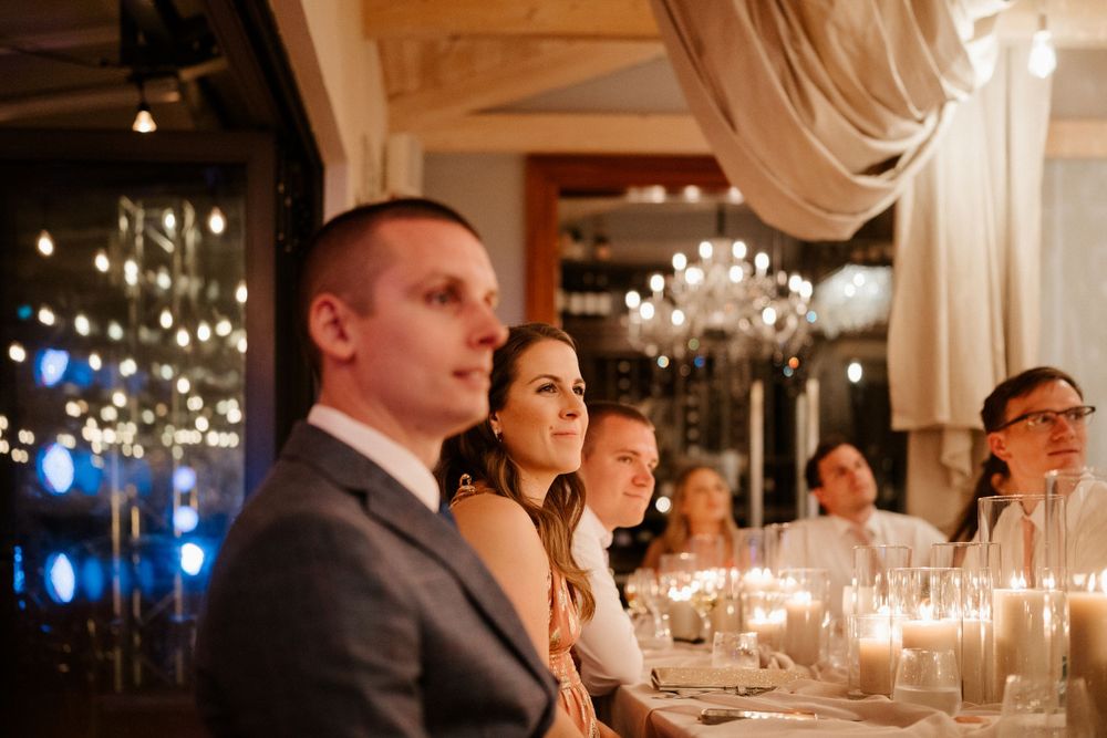 Elegant candlelit wedding reception with crystal chandeliers and romantic ambiance.