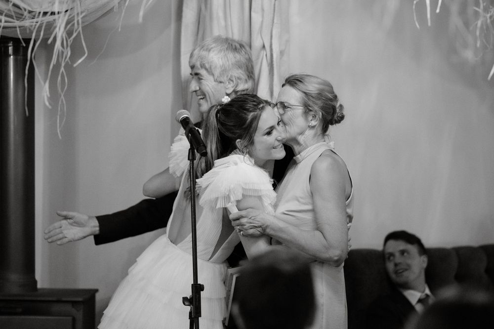 Black and white vintage style photograph of celebratory moment at wedding ceremony.