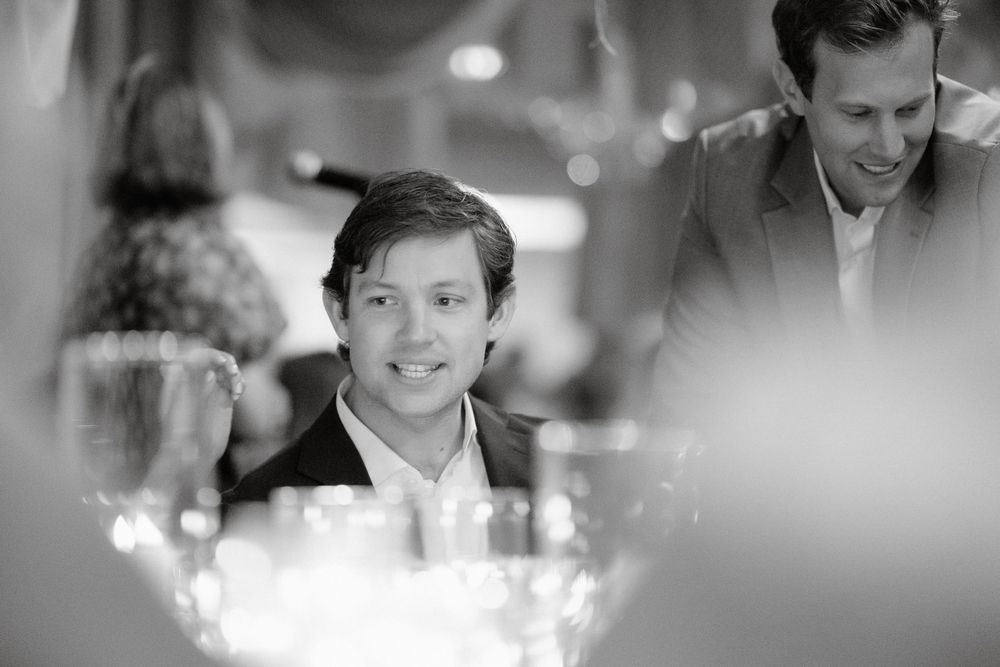 Candlelit reception creates intimate ambiance for evening dinner celebration.