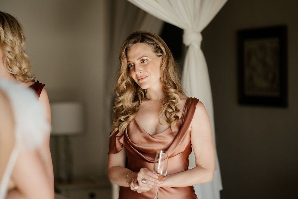 Elegant getting ready scene with soft lighting and rose gold details.