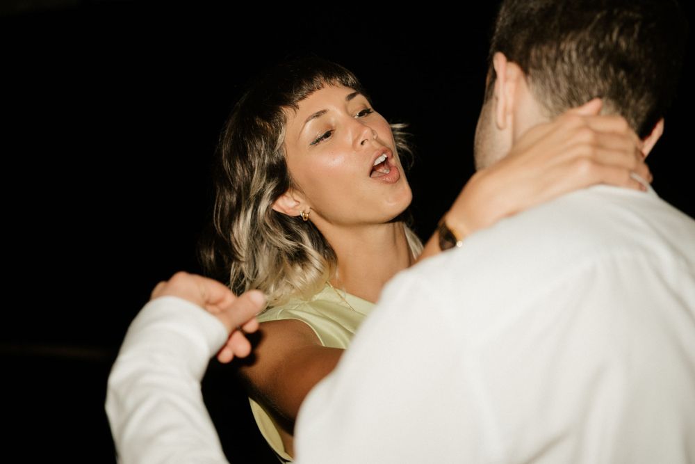 Couple sharing an intimate dance moment at their wedding reception.