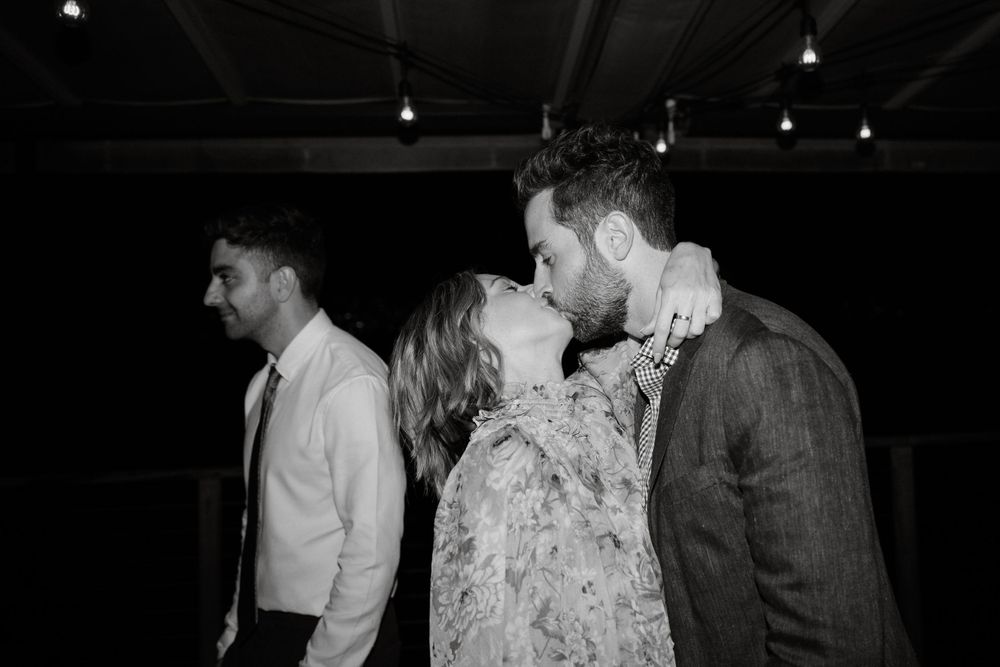 A couple sharing an intimate moment on the dance floor at their wedding reception.