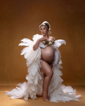 A serene artistic maternity photo sequence showing four poses in white feathered fabric against a brown backdrop.