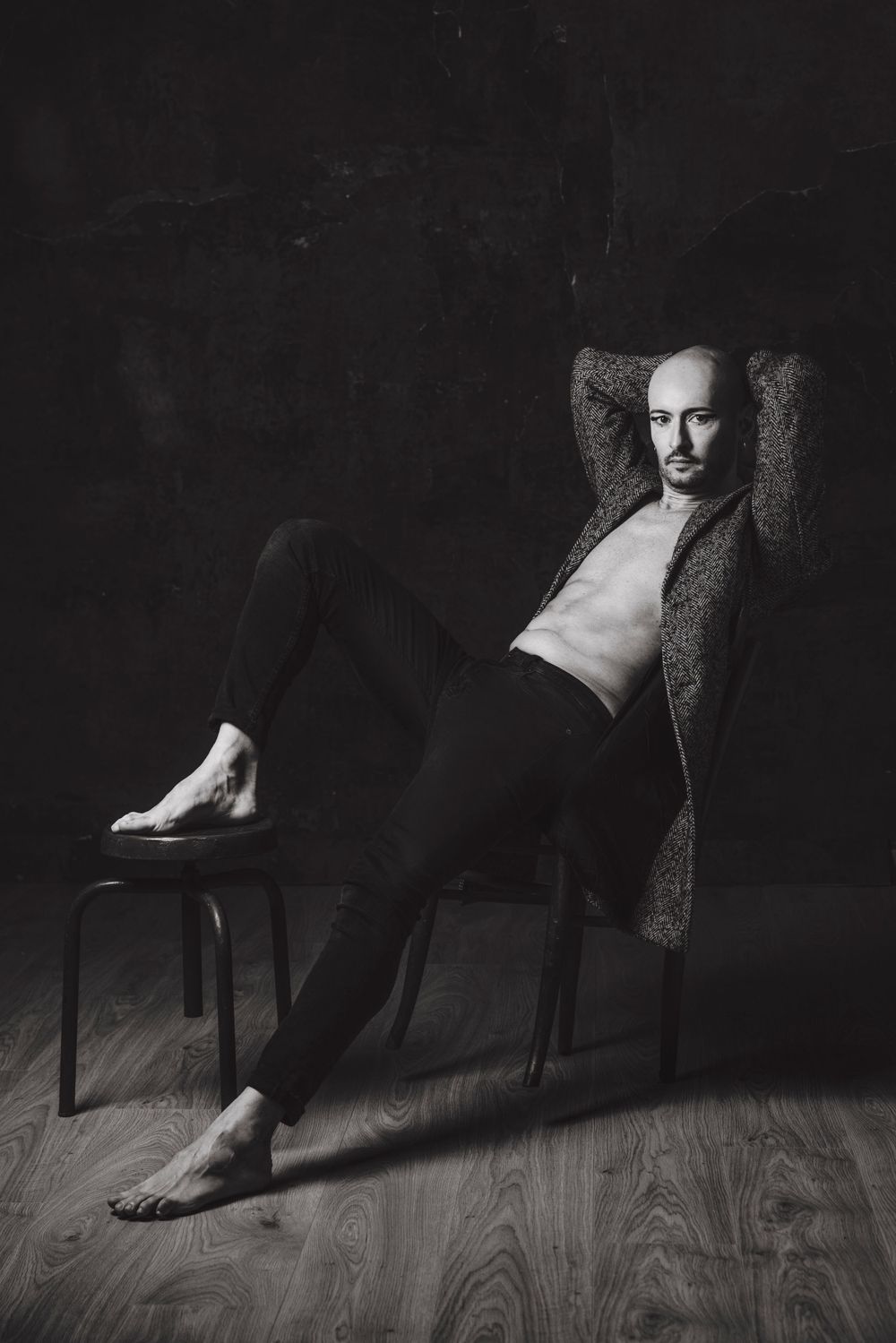 Artistic black and white photo series showing person seated in chair with dramatic shadows.