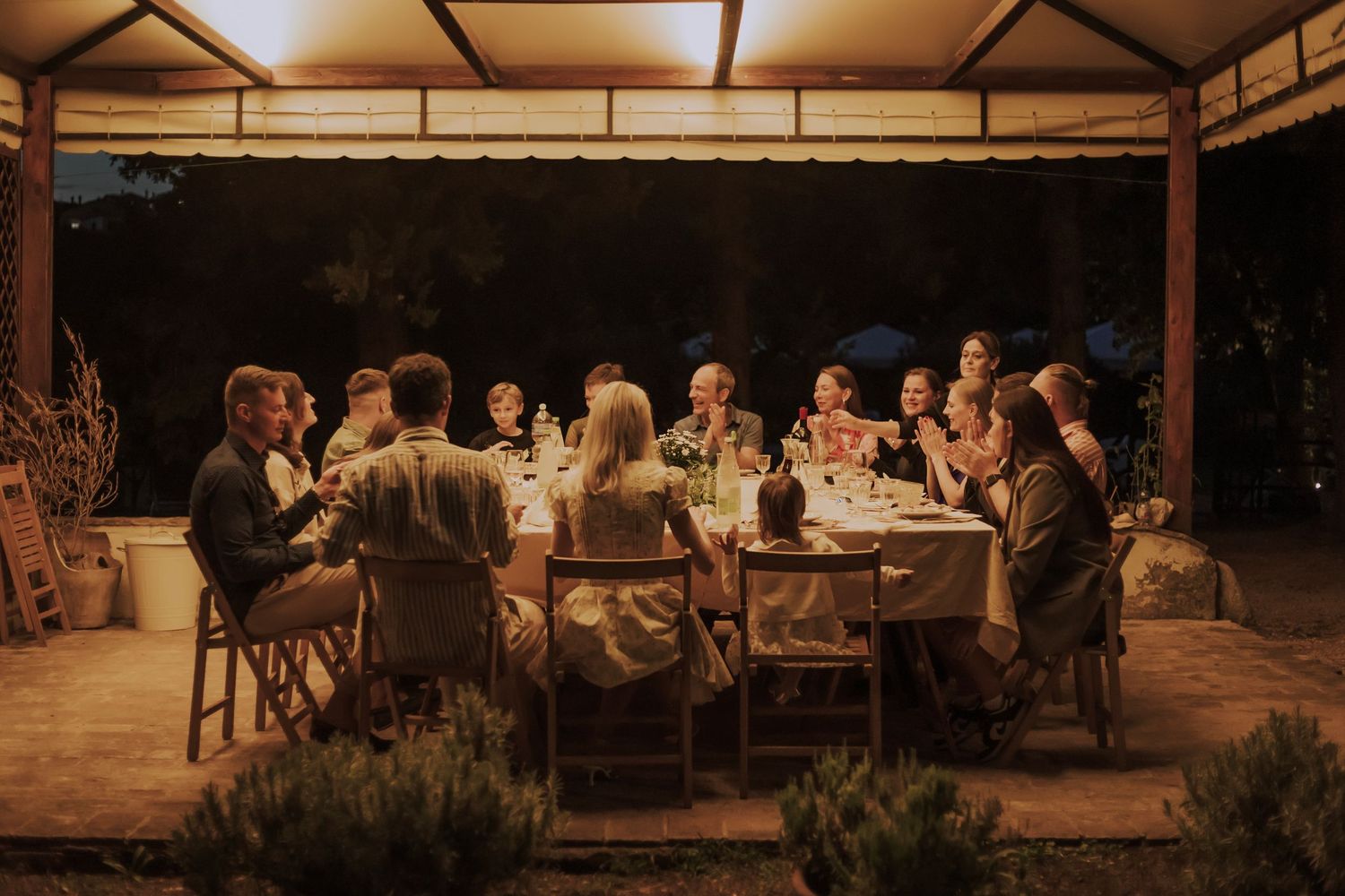 Family celebrating wedding anniversary in Umbria, Italy,