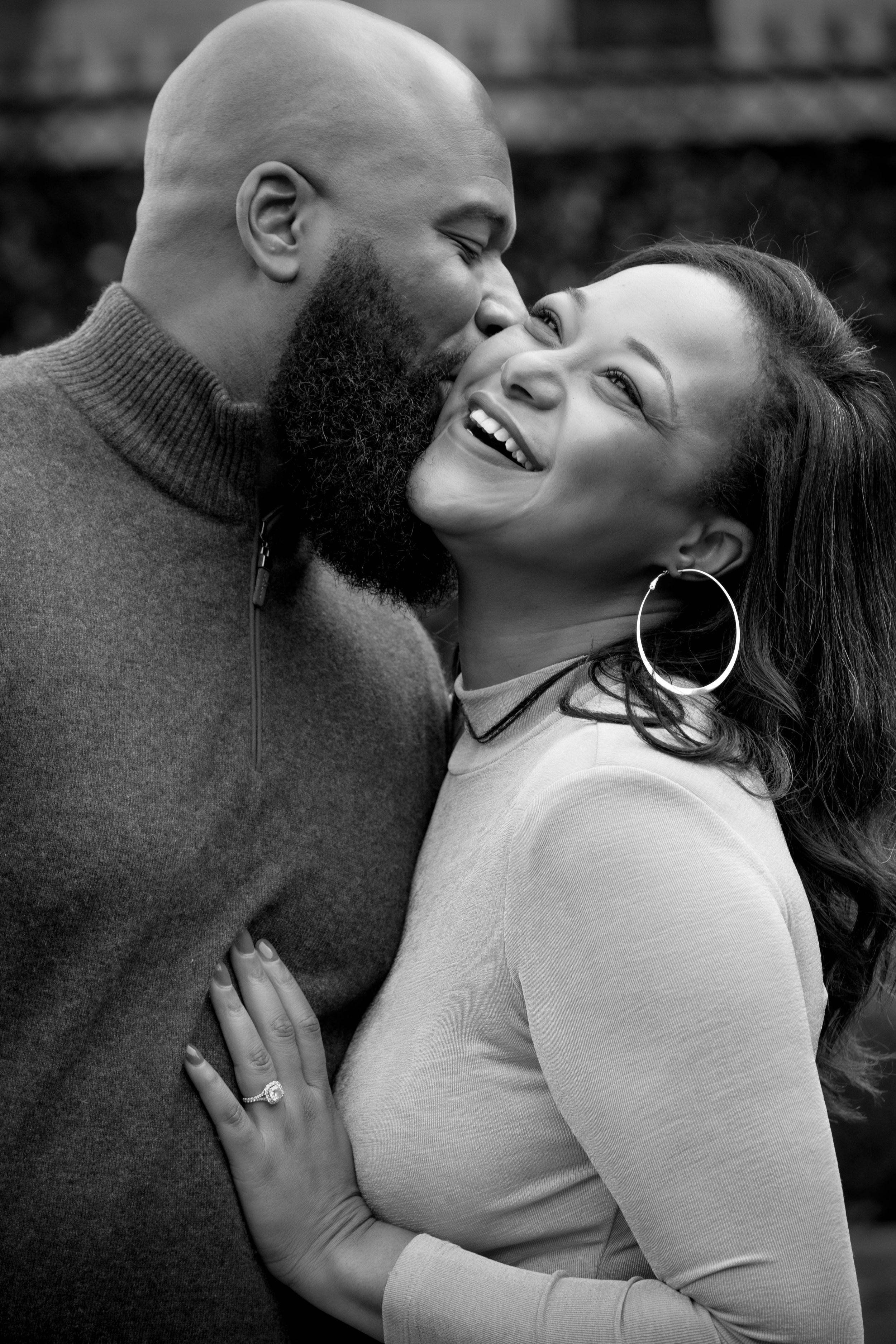 A romantic black and white photo series showing an intimate couple embracing and laughing together.