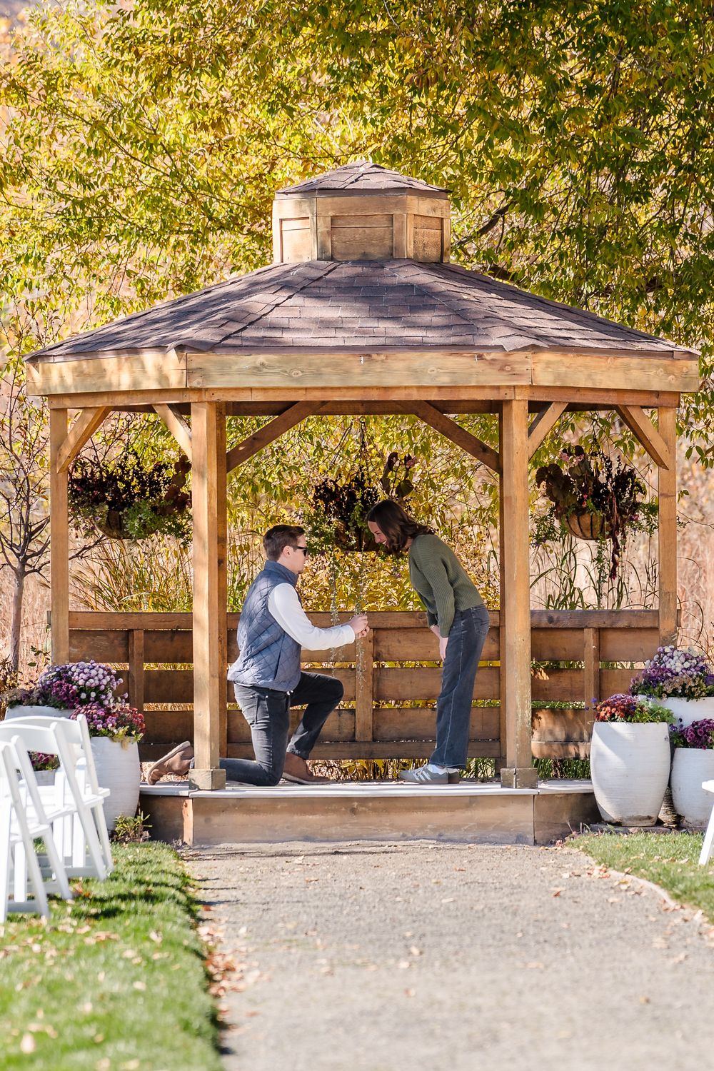 A sequence of photos showing a couple in a wooden gazebo during an autumn proposal moment.
