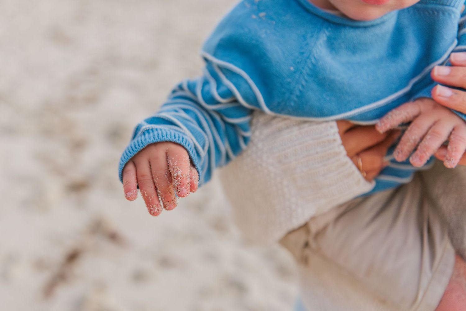 Windansea Beach family photos in San Diego with playful, candid moments by the ocean.