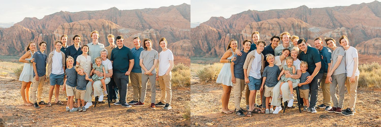 Large extended family poses together in front of scenic desert canyon landscape.