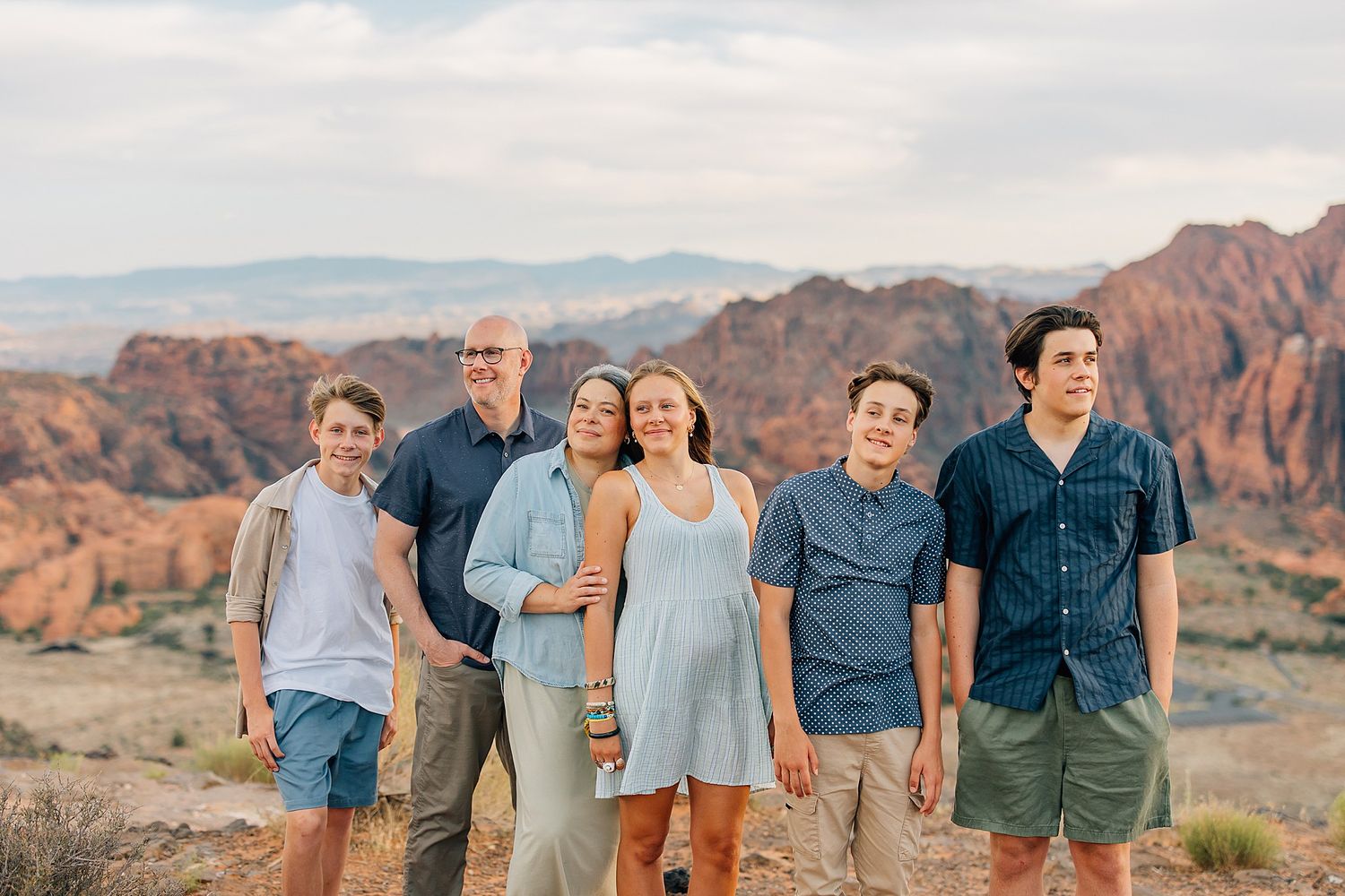 Family photography session with dramatic desert mountain scenery in Snow Canyon.