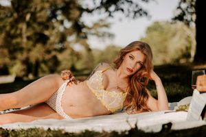Romantic outdoor portrait session with golden hour lighting and elegant styling.