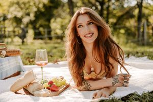 Candid outdoor photography with white blanket and natural backlit scenery.