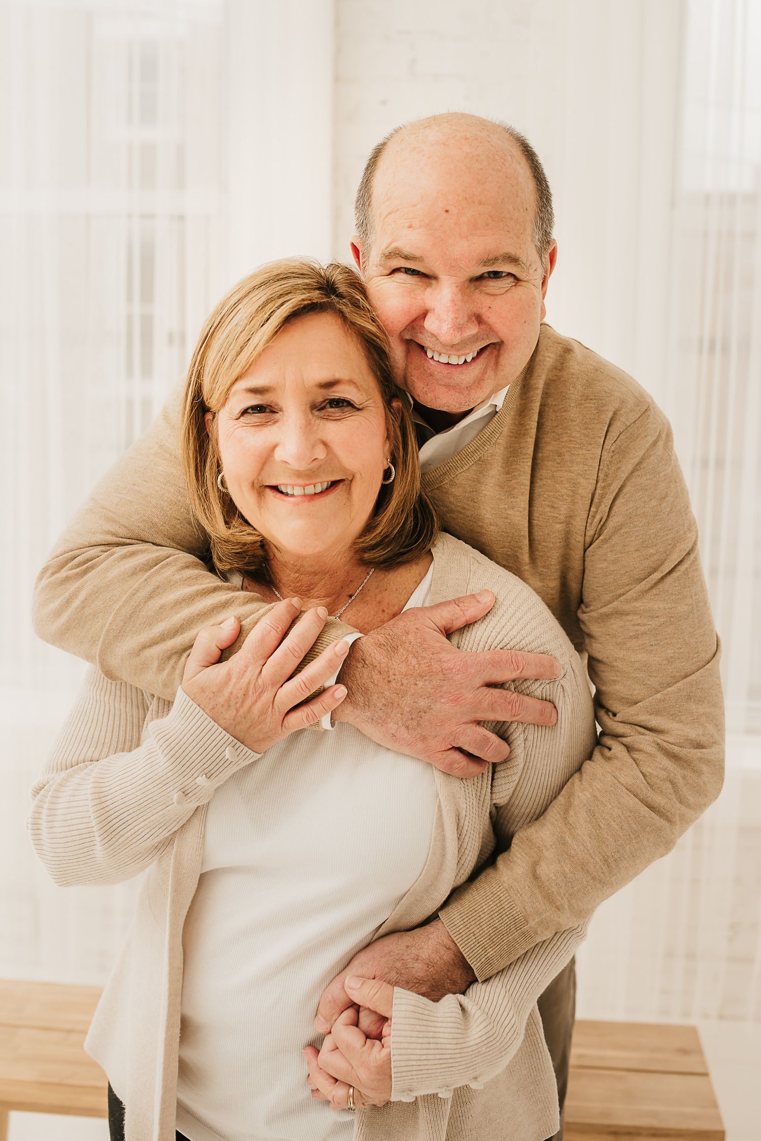 Playful family moment captured in a natural-light Cincinnati photography studio.