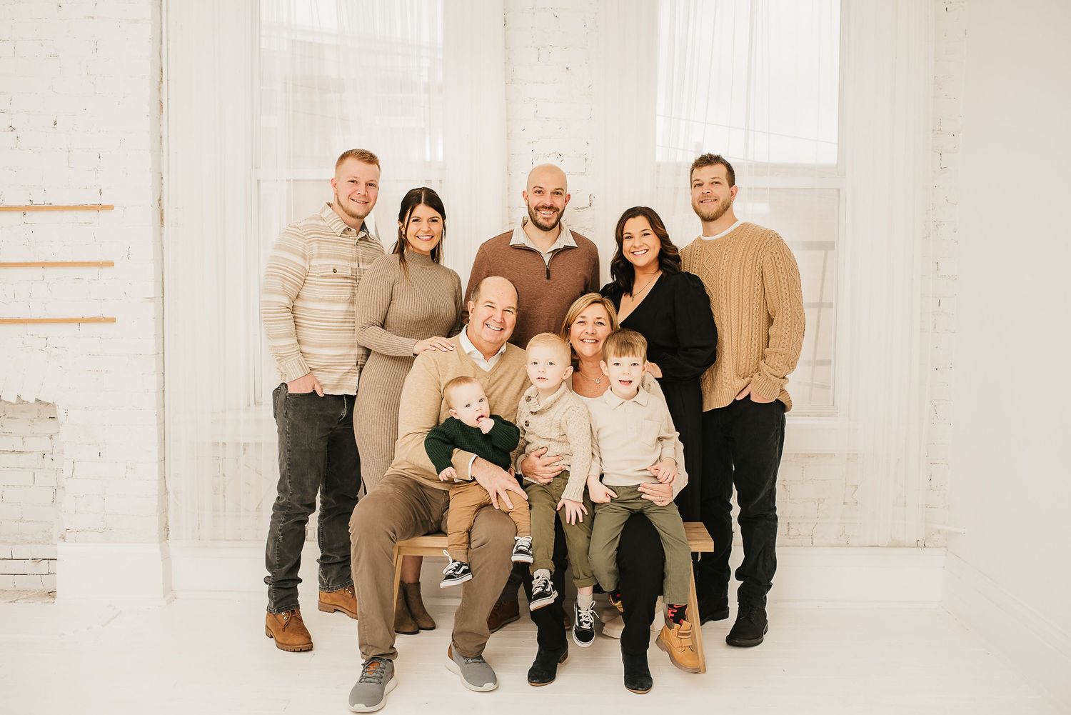 Playful family moment captured in a natural-light Cincinnati photography studio.