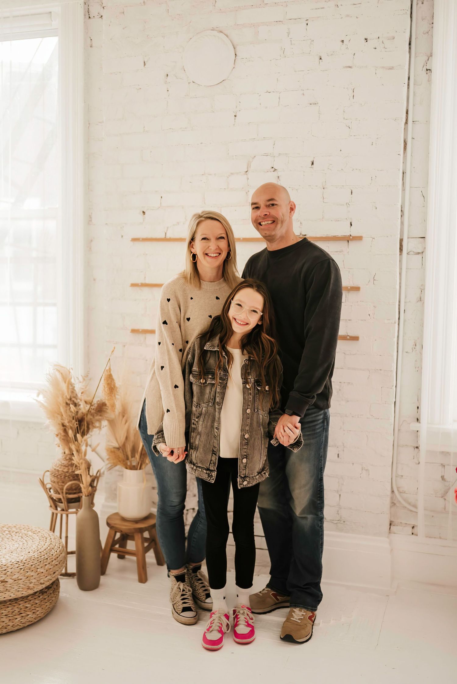 Cincinnati photographer capturing family photos in a bright, airy studio.