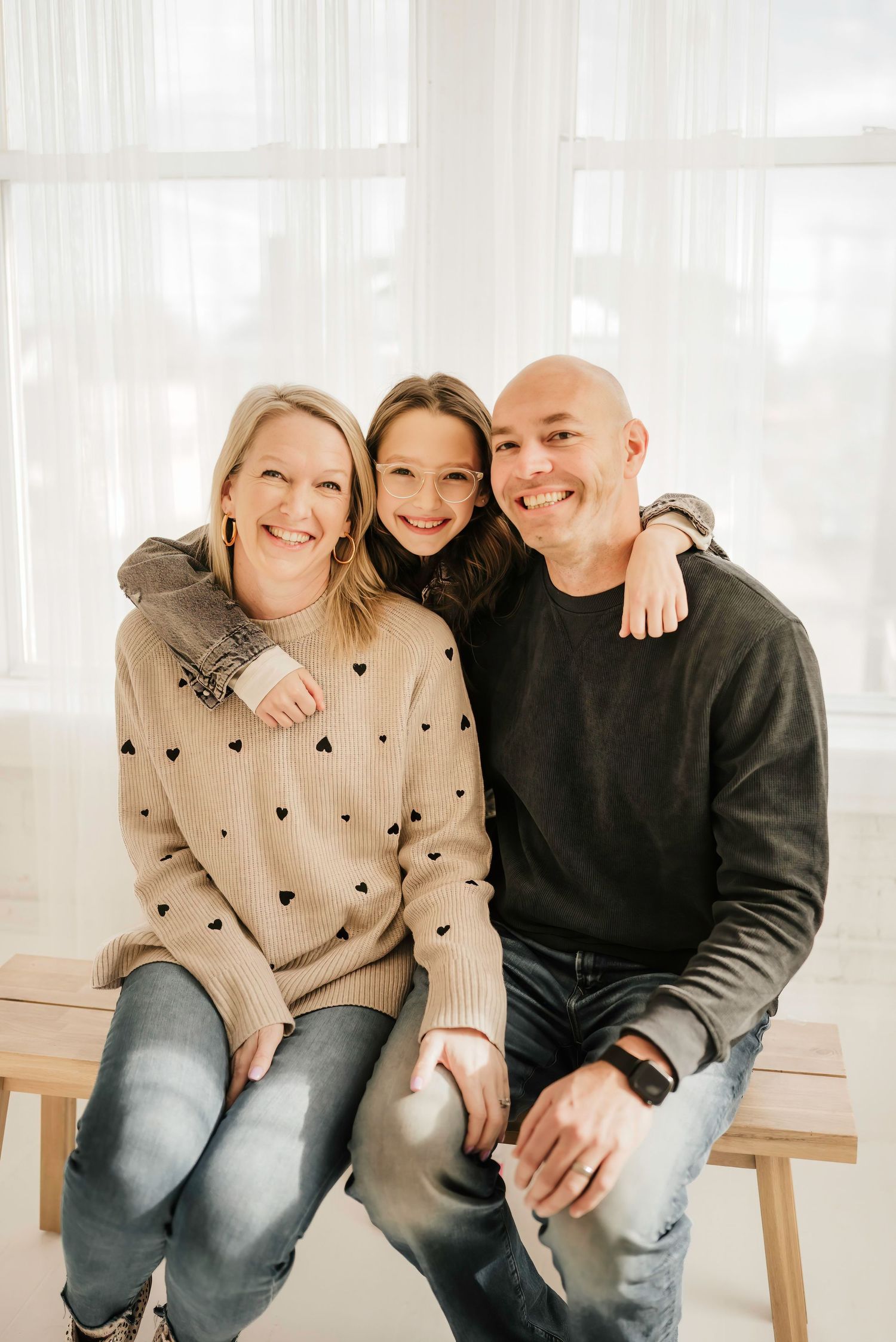 Cincinnati photographer capturing family photos in a bright, airy studio.
