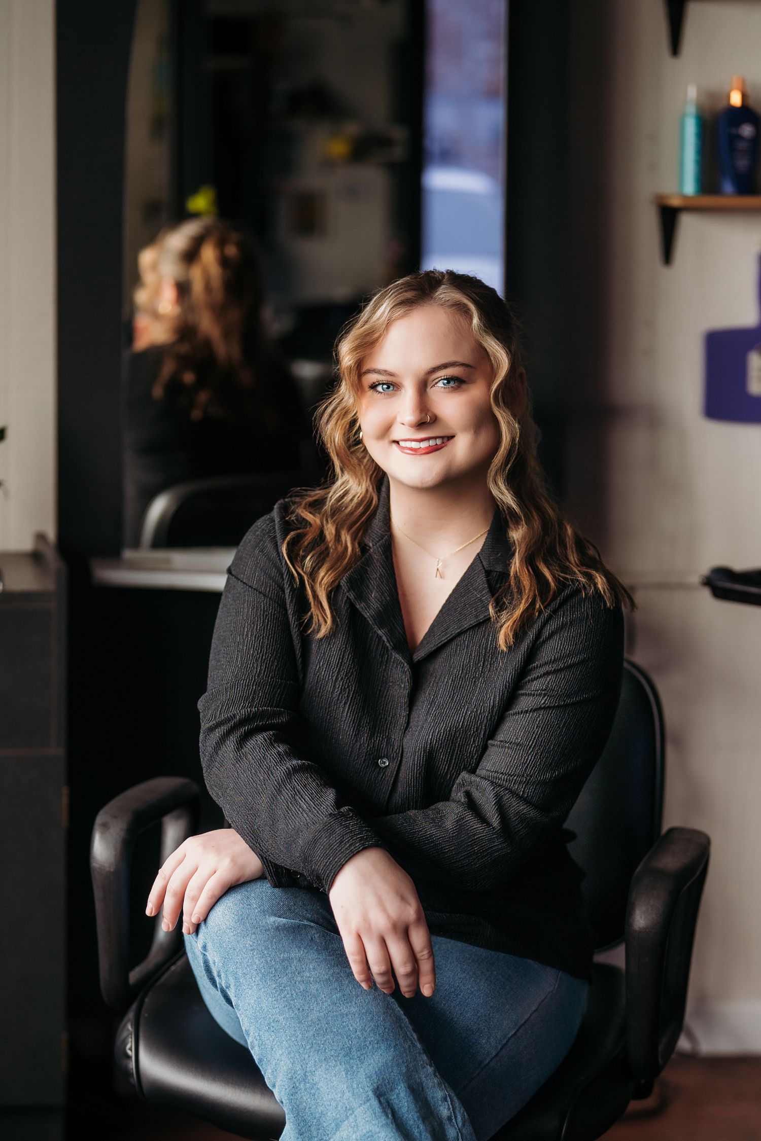 Delaware hair dresser sitting in her salon chair for a branding session