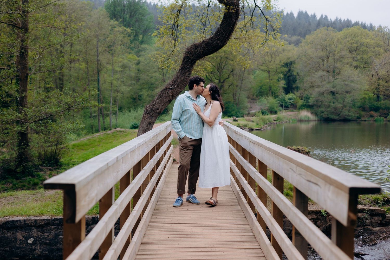 Romantic pre wedding photoshoot in the Forest of Dean capturing natural candid moments between engaged couple.