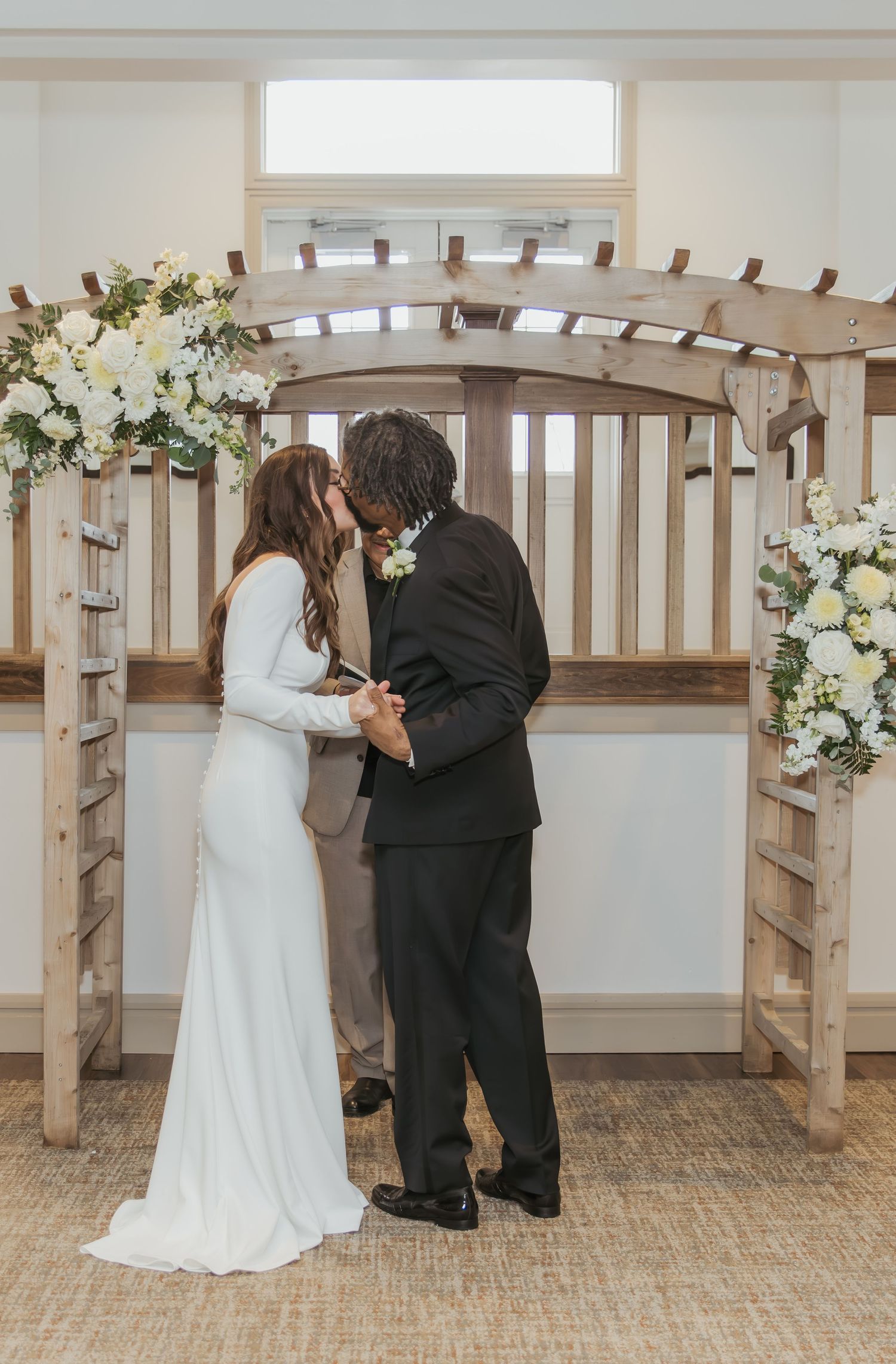 Wedding ceremony bride and groom kiss after getting married in Zionsville, Indiana at Holliday Farms