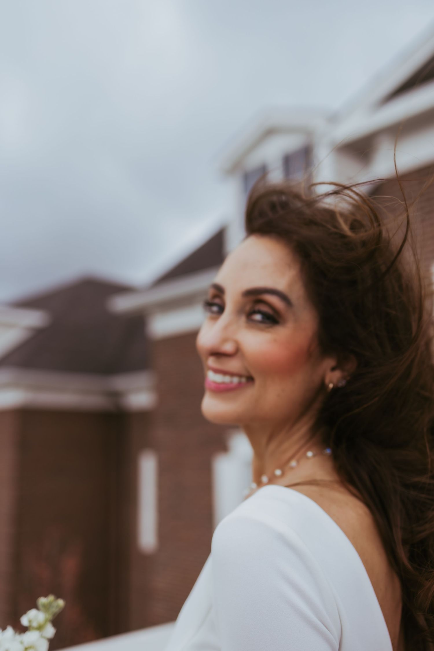 Bridal portrait on a windy day after getting married at Holliday Farms in Zionsville, Indiana