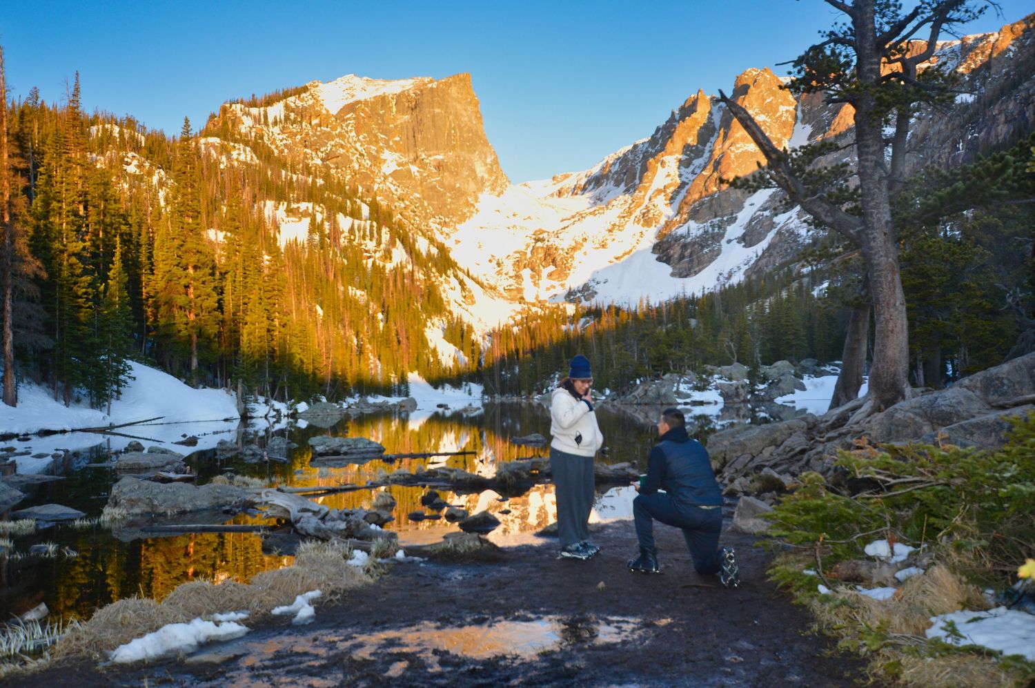 Surprise sunrise proposal at Dream Lake in Rocky Mountain National Park.