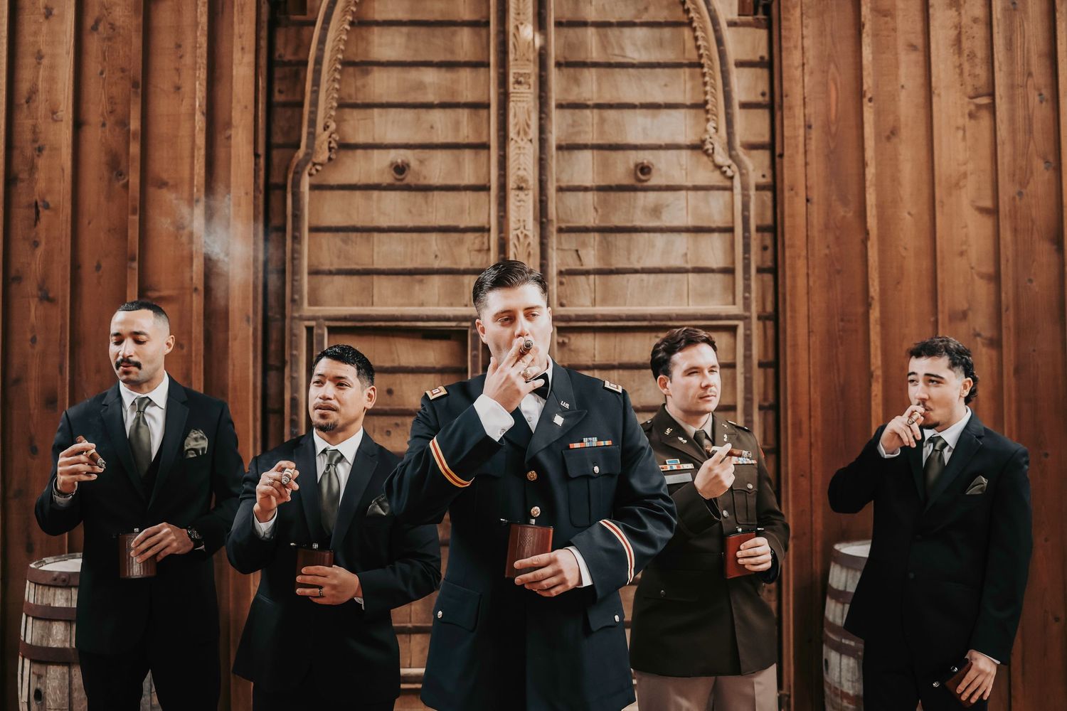 Groomsmen standing together in black-tie attire at Lucky Spur Ranch for an editorial wedding portrait.